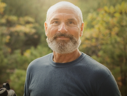 Campaign image of older gentleman smiling. Actor portrayal
