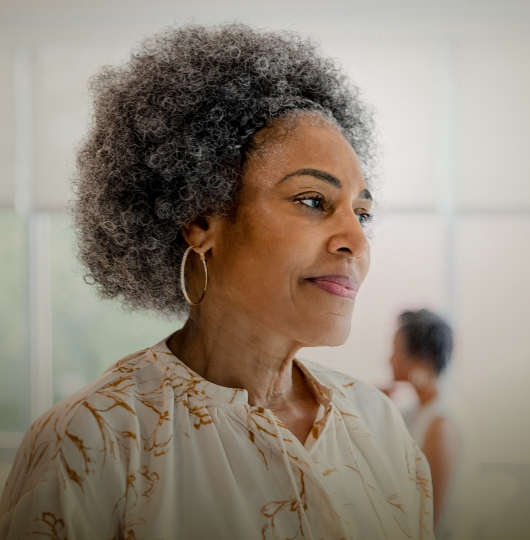 Campaign image of woman smiling. Actor portrayal